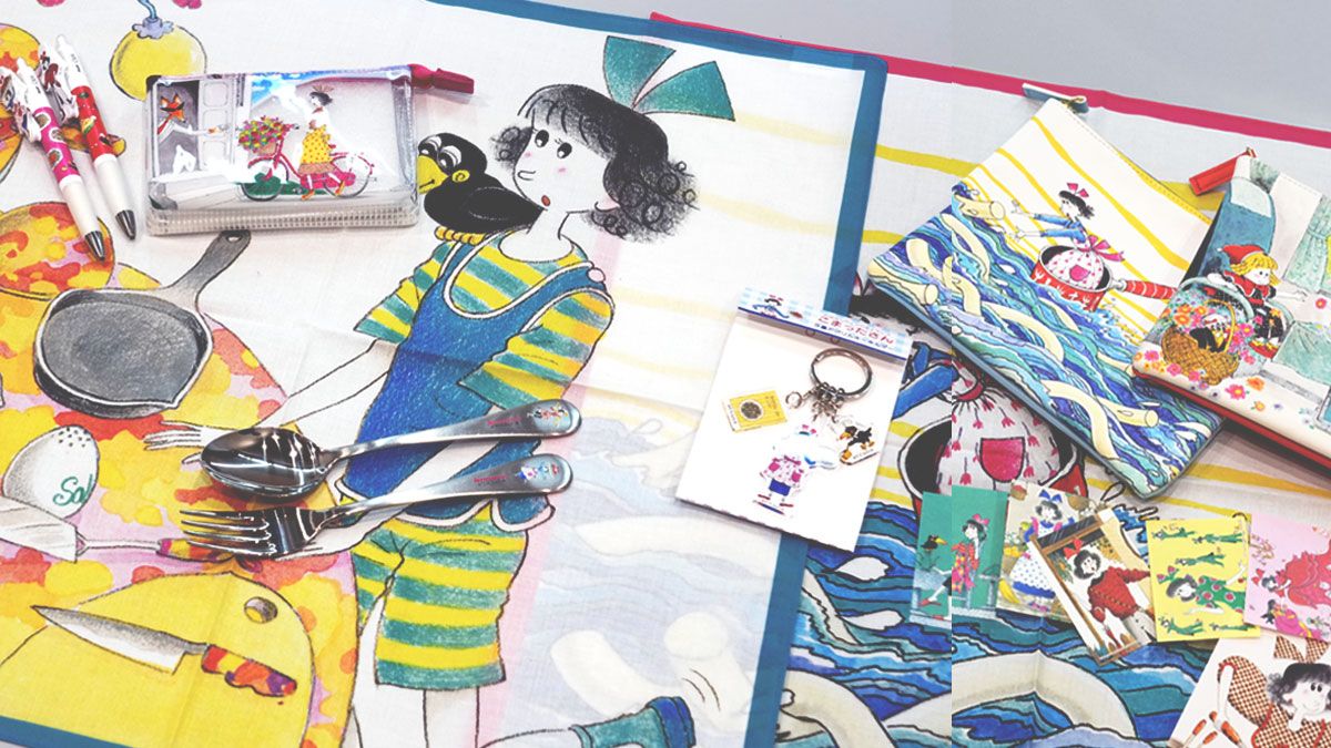 「EHONZ」の前で、おすすめの絵本グッズを持つ丸善丸の内店店長の篠田晃典氏（右）と店舗開発に携わる中﨑悠人氏（左）